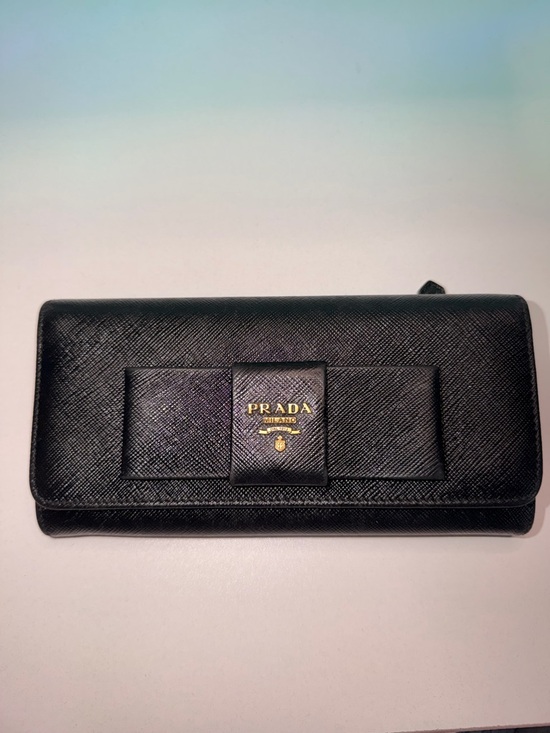 Prada Handbags - Prada Black Saffiano Leather Bow Wallet with Gold Logo